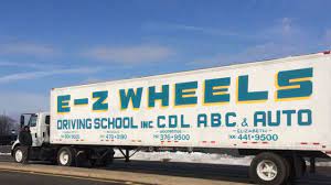 EZ Wheels Driving School logo