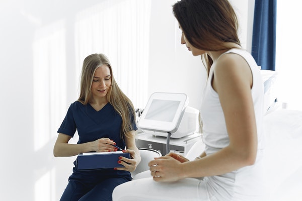 bedside LPN helping her patient