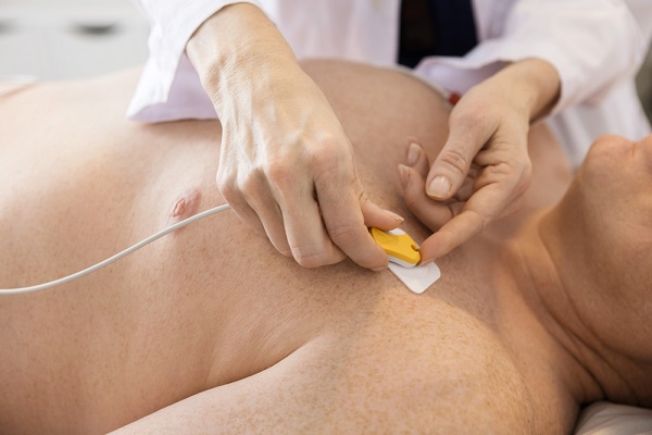 electrodes being placed on patient