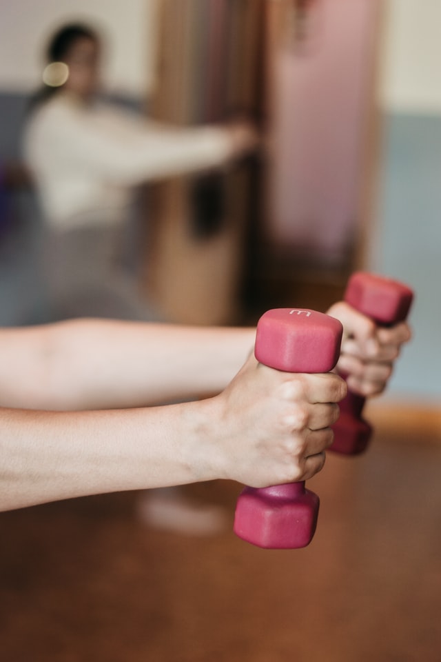 holding dumbbells in physical therapy