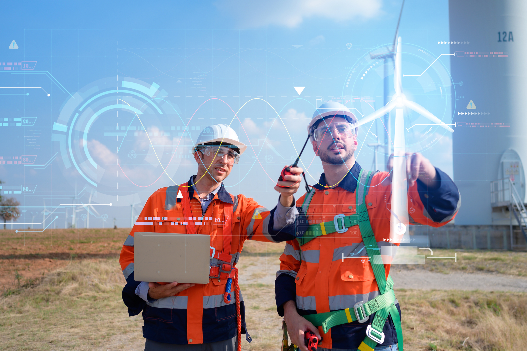Both of Engineers are controlling a wind turbine with AI technology for precision and accuracy with minimal errors.