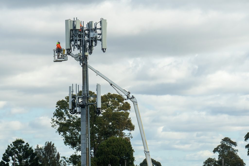 Works on the transmitter tower with telecommunication equipment