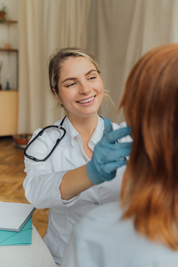 licensed practical nurse assessing patient