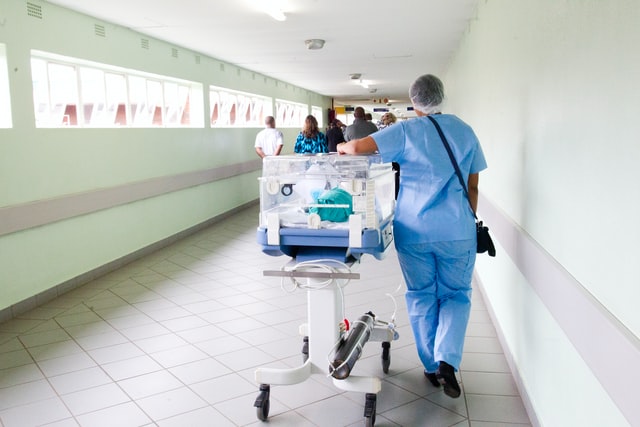 patient care technician walking in the hospital