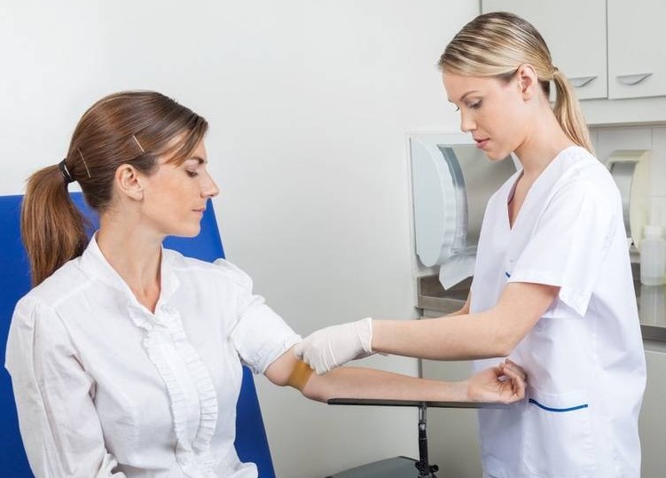 phlebotomist with a patient