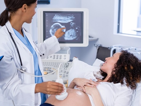 ultrasound technician with a patient