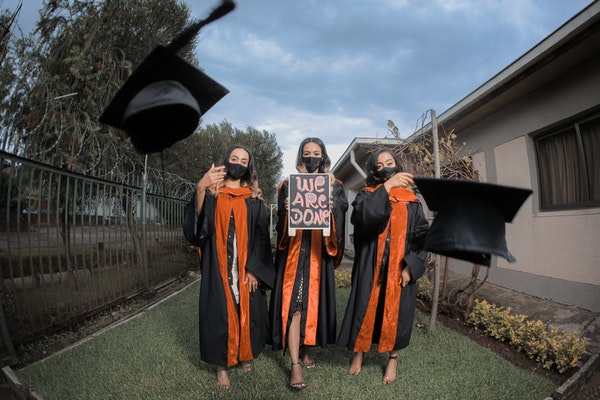 young students after graduation on their way to become medical billers and coders